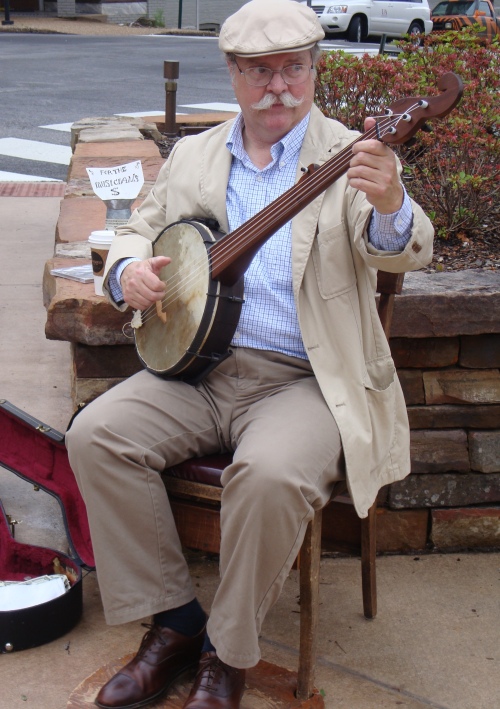 A local banjo player plays music. 